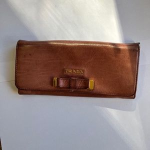 Prada pink and gold bow wallet